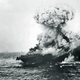 A devastating explosion rocks USS Lexington as torpedoes stored belowdecks detonate. The carrier USS Yorktown can be seen on the horizon in the distance. (US Navy)